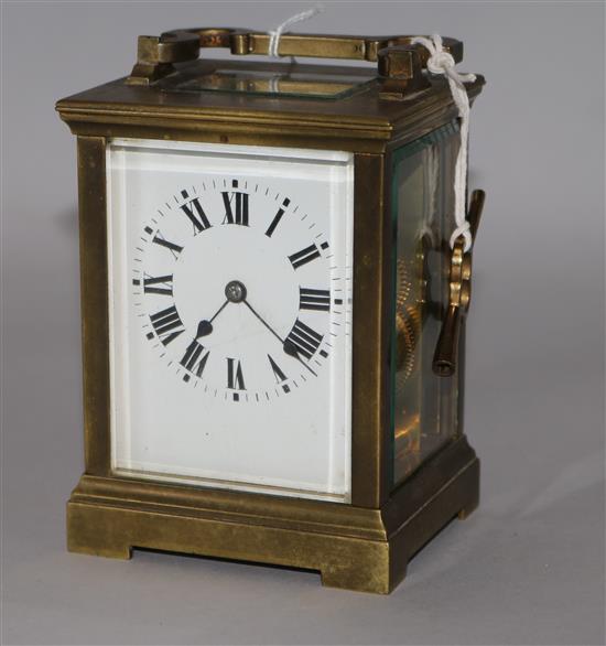 A gilt brass carriage clock, late 19th/early 20th century, with eight day movement and white-enamelled dial